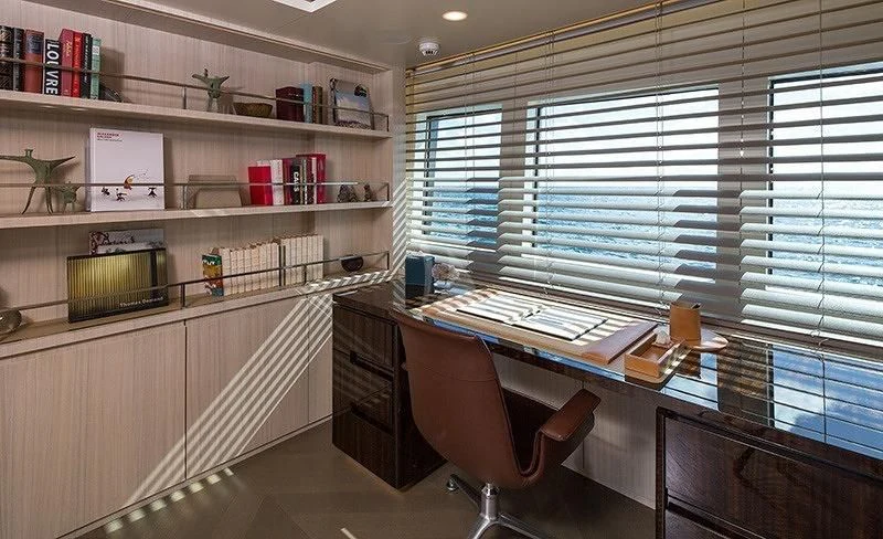 a room with a desk and a chair aboard REVERIE Yacht for Sale