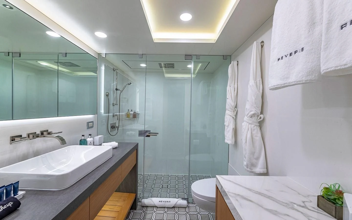 a bathroom with a glass shower aboard REVERIE Yacht for Sale