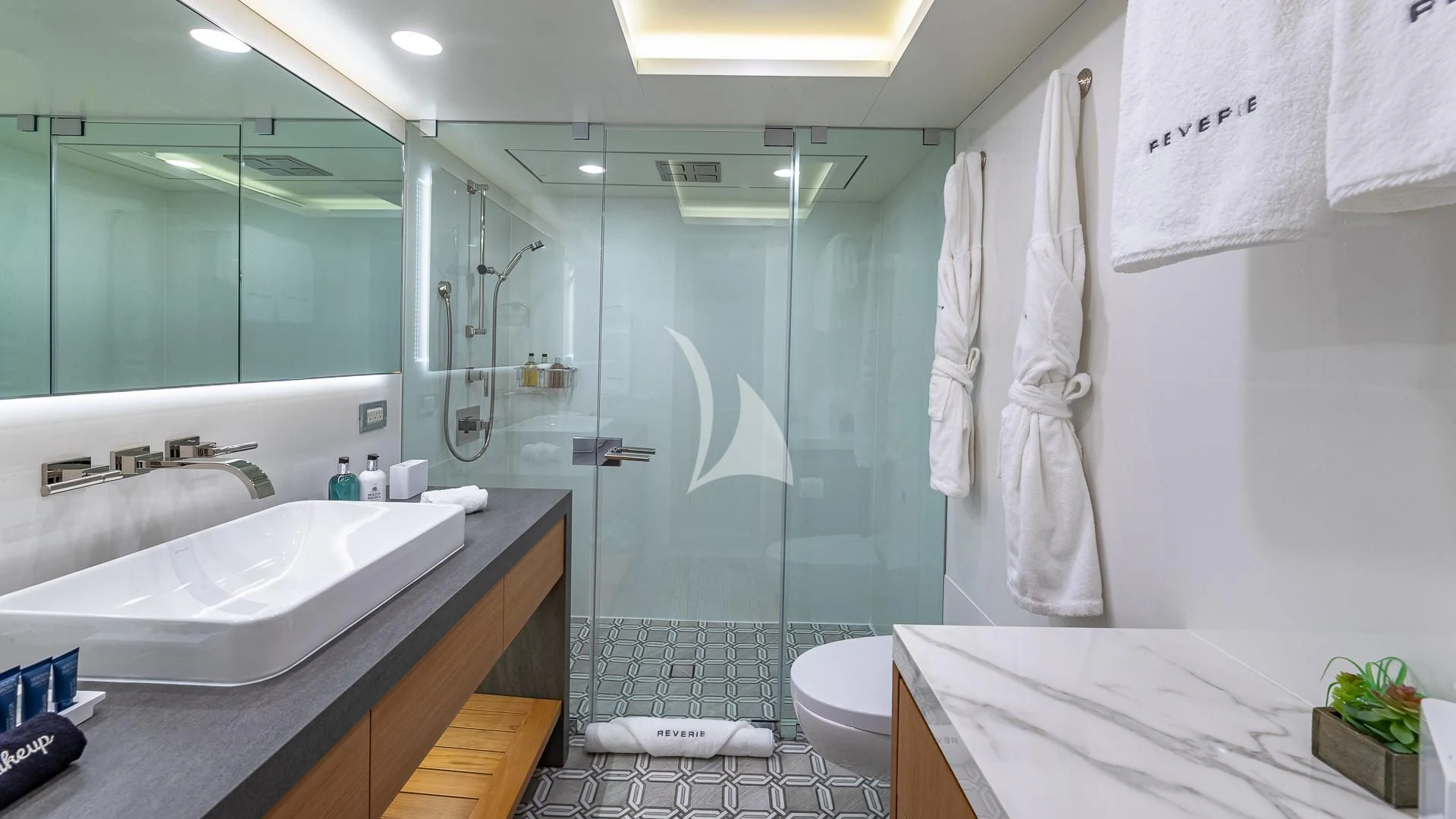 a bathroom with a glass shower aboard REVERIE Yacht for Sale