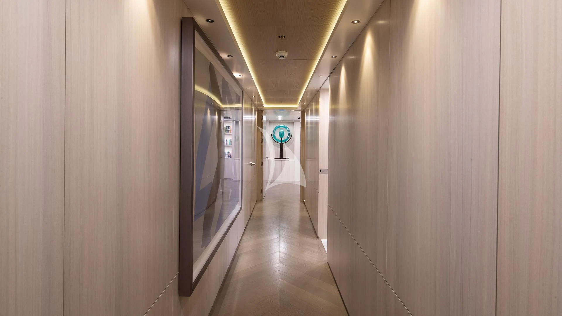 a hallway with a door and a sign on the wall aboard REVERIE Yacht for Sale
