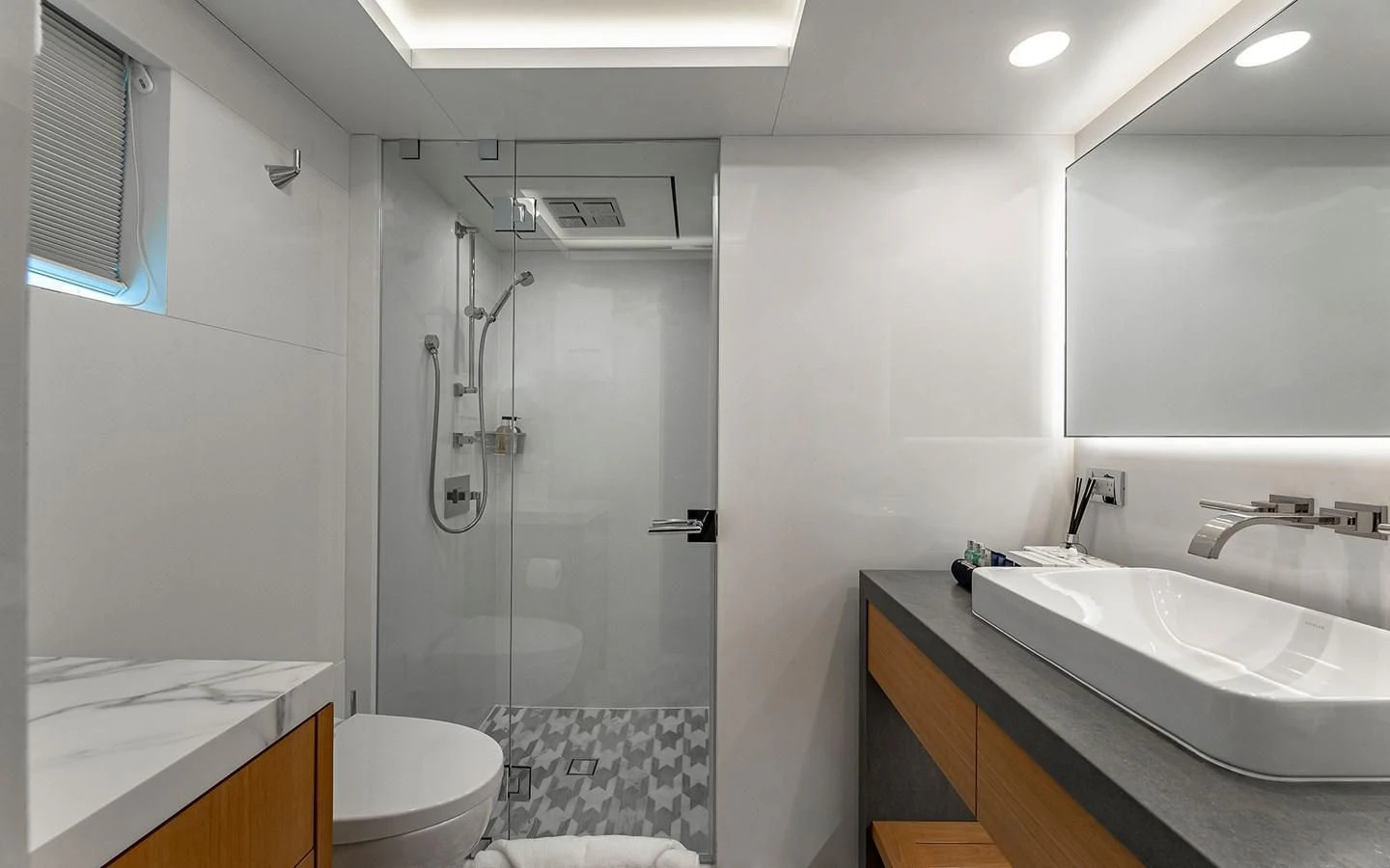 a bathroom with a glass shower aboard REVERIE Yacht for Sale