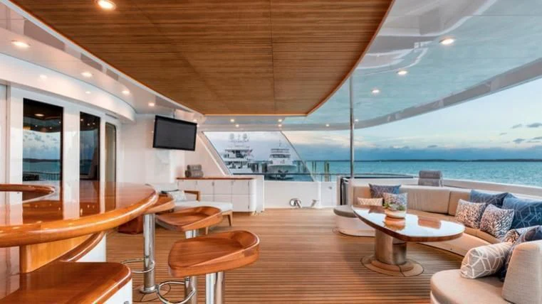 a living room with a large balcony aboard REVERIE Yacht for Sale