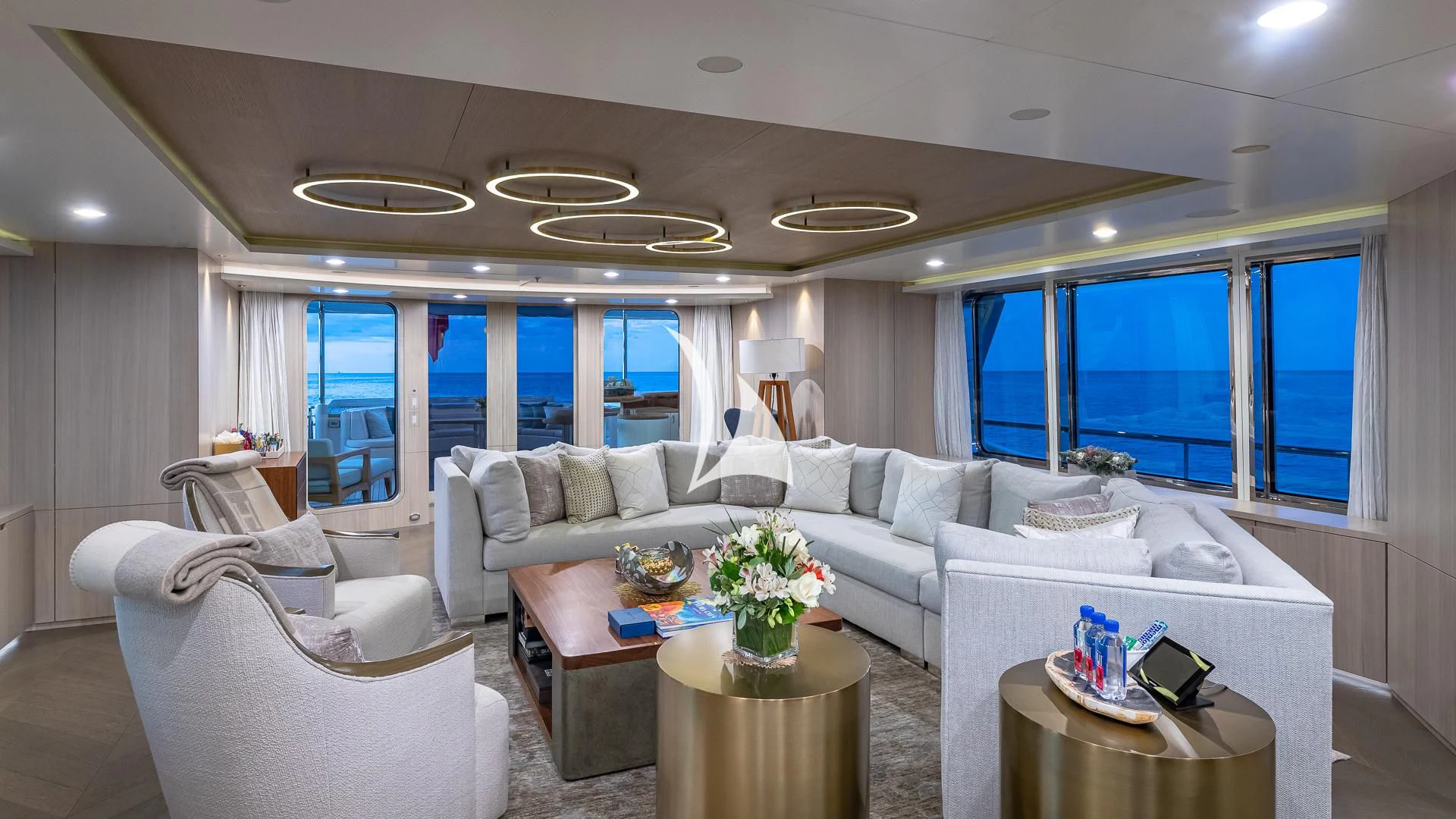 a living room with a large window aboard REVERIE Yacht for Sale