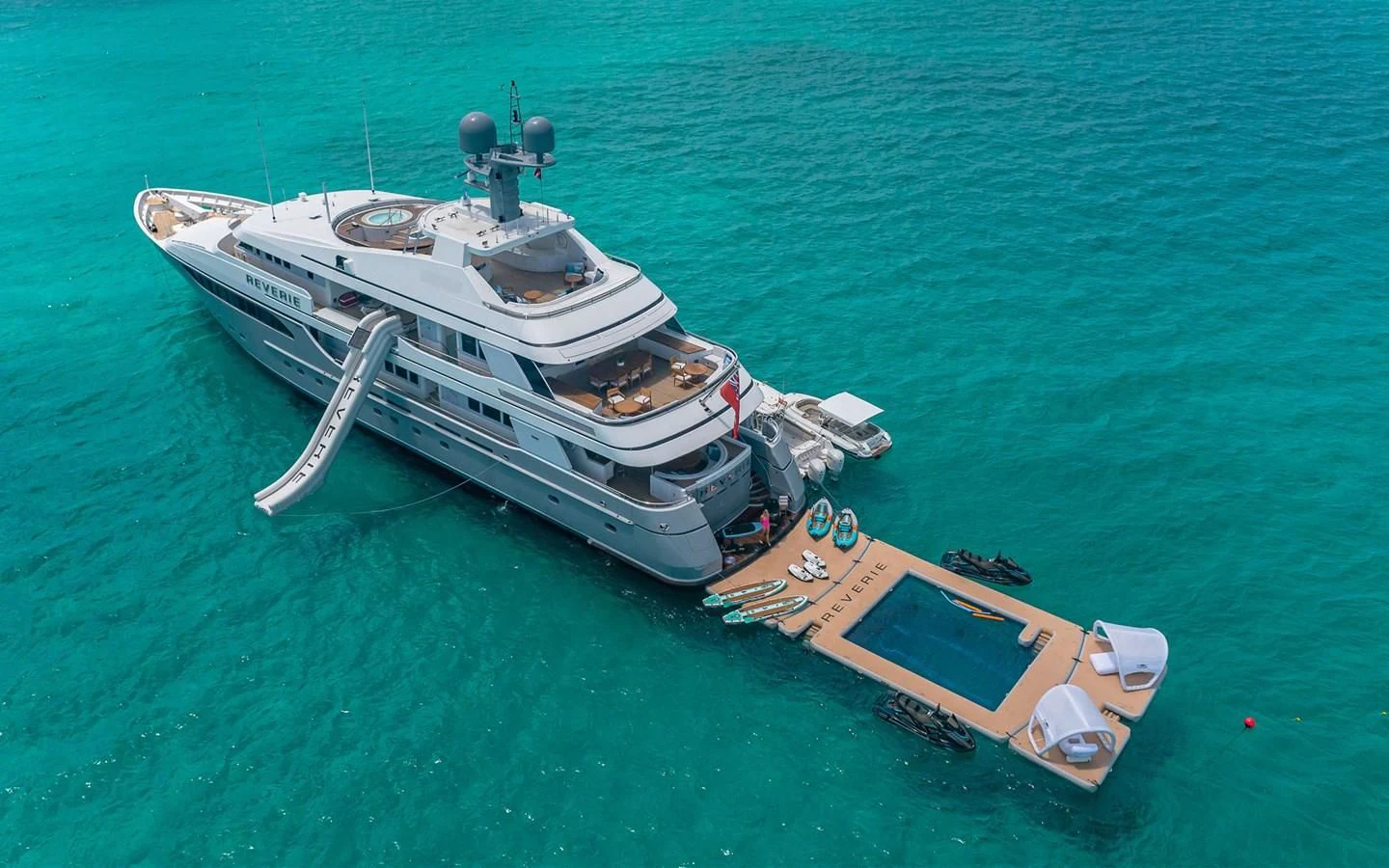 a boat and a submarine in the water aboard REVERIE Yacht for Sale