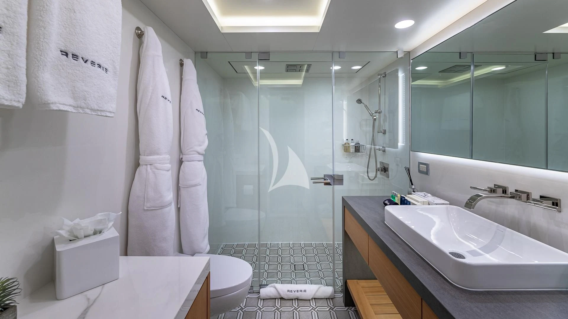 a bathroom with a shower and a sink aboard REVERIE Yacht for Sale