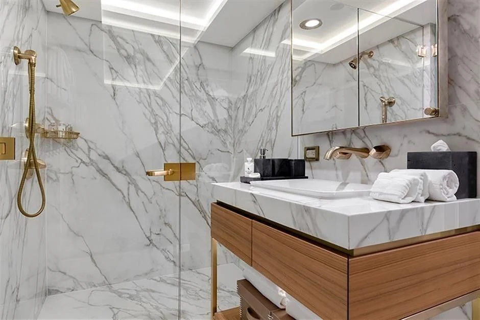 a bathroom with a sink and a mirror aboard REVERIE Yacht for Sale