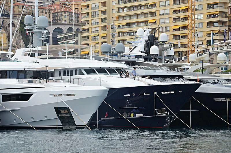several boats docked in a harbor aboard REVERIE Yacht for Sale