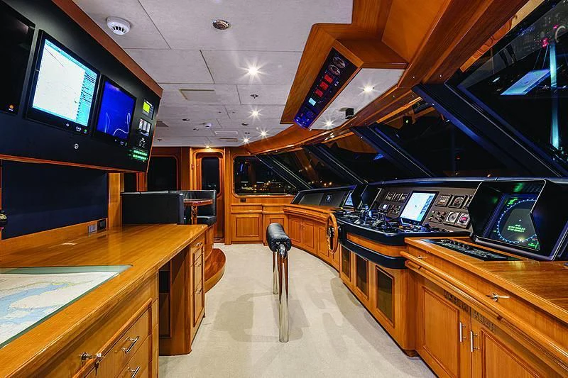 a room with a tv and a table aboard REVERIE Yacht for Sale
