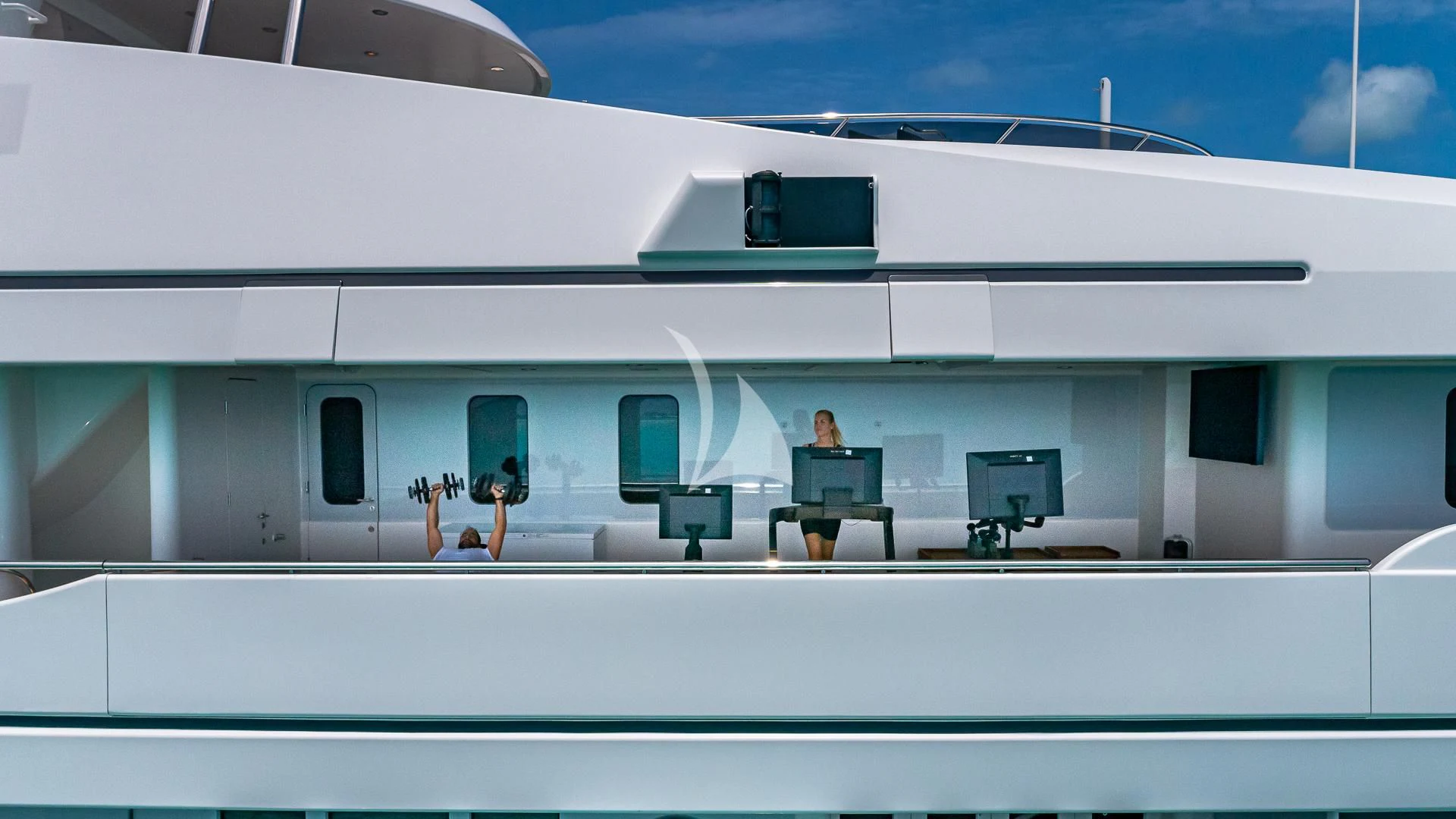 a building with a few people aboard REVERIE Yacht for Sale
