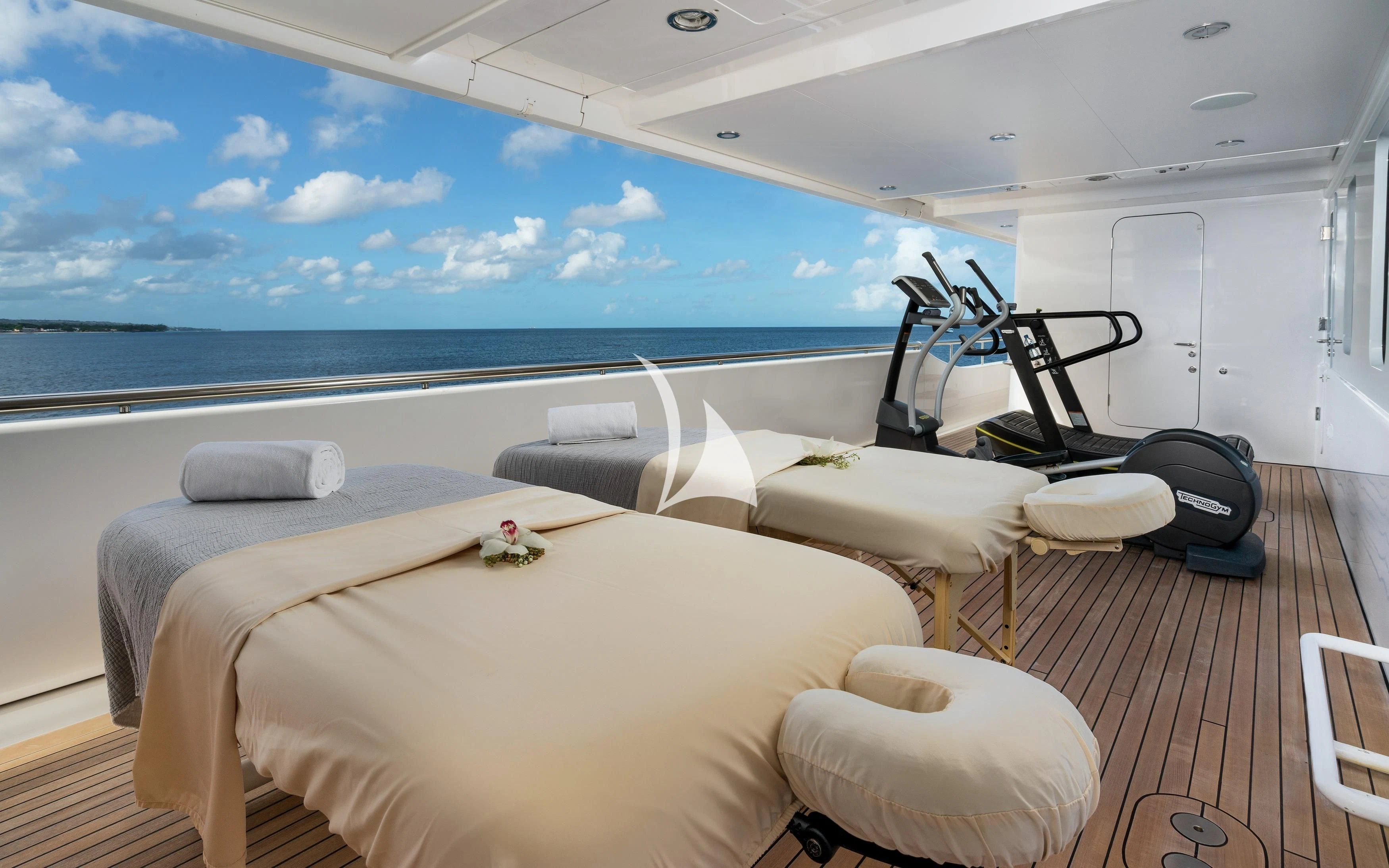 a room with a bed and a large window overlooking the ocean aboard REVERIE Yacht for Sale
