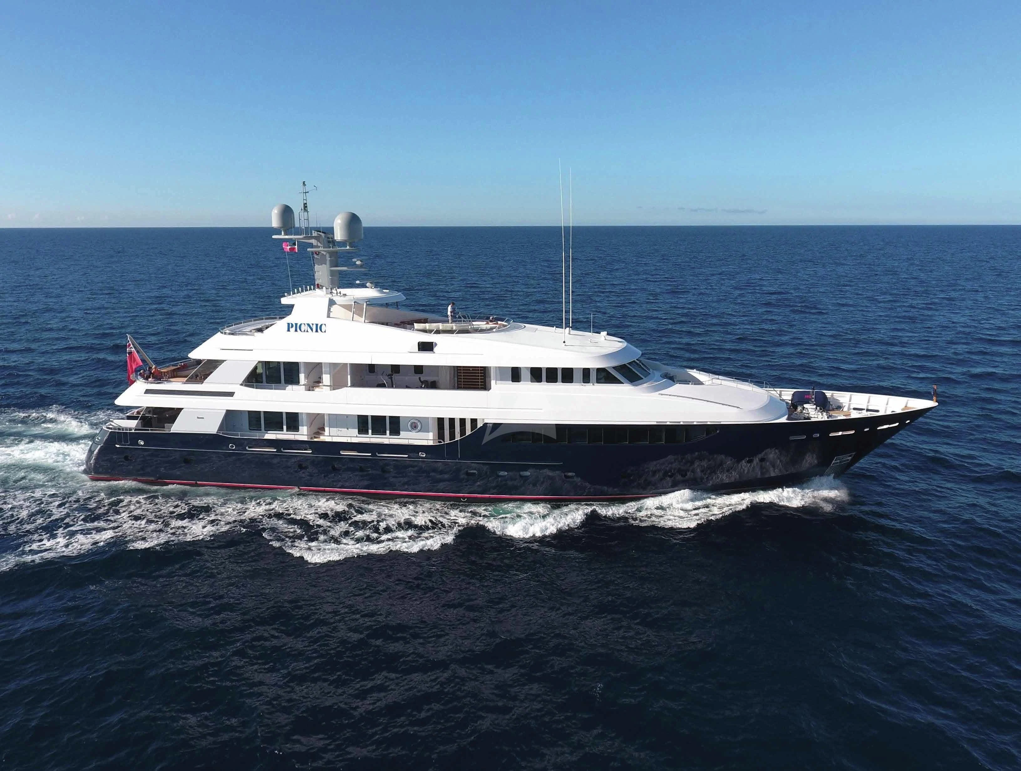 a large boat on the water aboard REVERIE Yacht for Sale