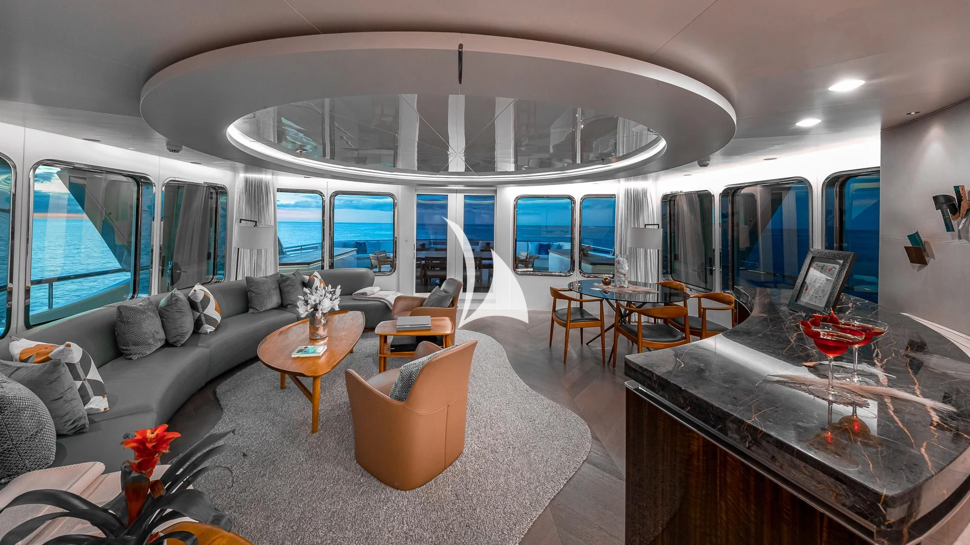 a living room with a large window aboard REVERIE Yacht for Sale