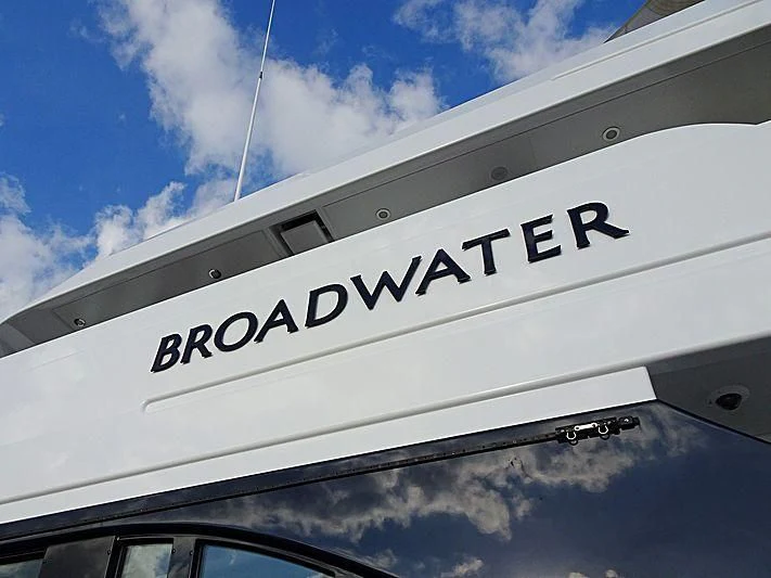 a white sign with black text aboard REVERIE Yacht for Sale