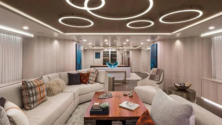 a living room with a couch and a table aboard REVERIE Yacht for Sale