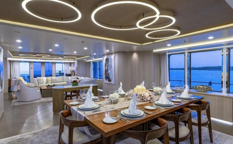 a large dining room with a large table and chairs aboard REVERIE Yacht for Sale