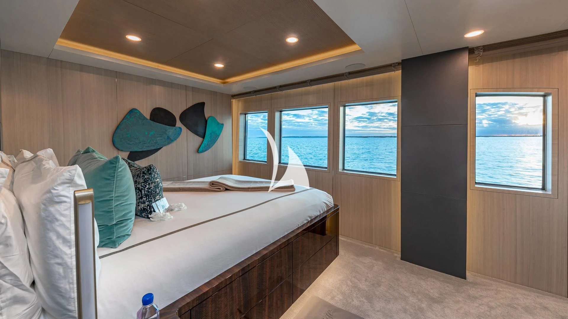 a room with a bed and a window aboard REVERIE Yacht for Sale