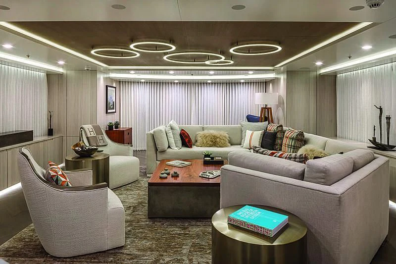 a living room with a couch and a coffee table aboard REVERIE Yacht for Sale