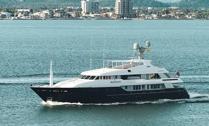 a large boat on the water aboard REVERIE Yacht for Sale