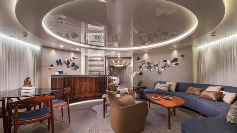 a living room with a couch and a table aboard REVERIE Yacht for Sale