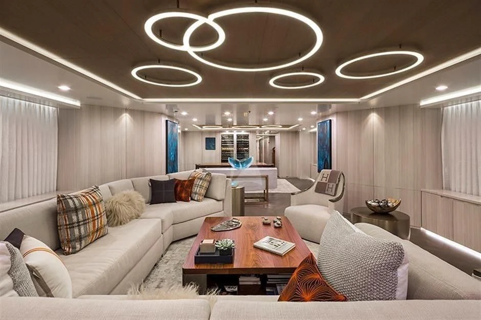 a living room with a couch and a table aboard REVERIE Yacht for Sale