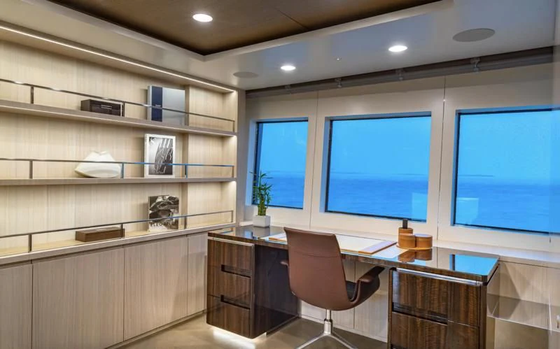 a room with a desk and a computer aboard REVERIE Yacht for Sale