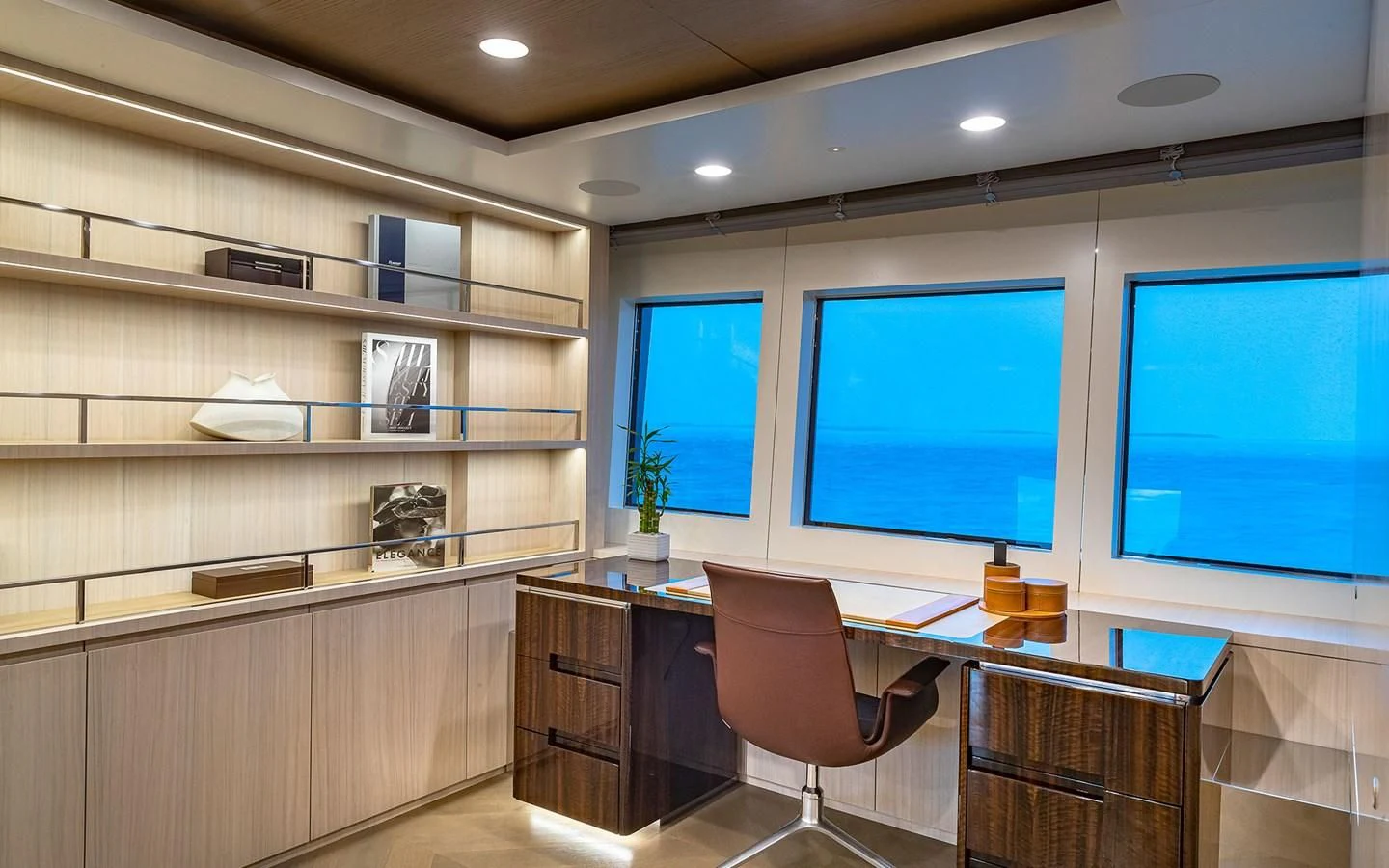a room with a desk and a computer aboard REVERIE Yacht for Sale