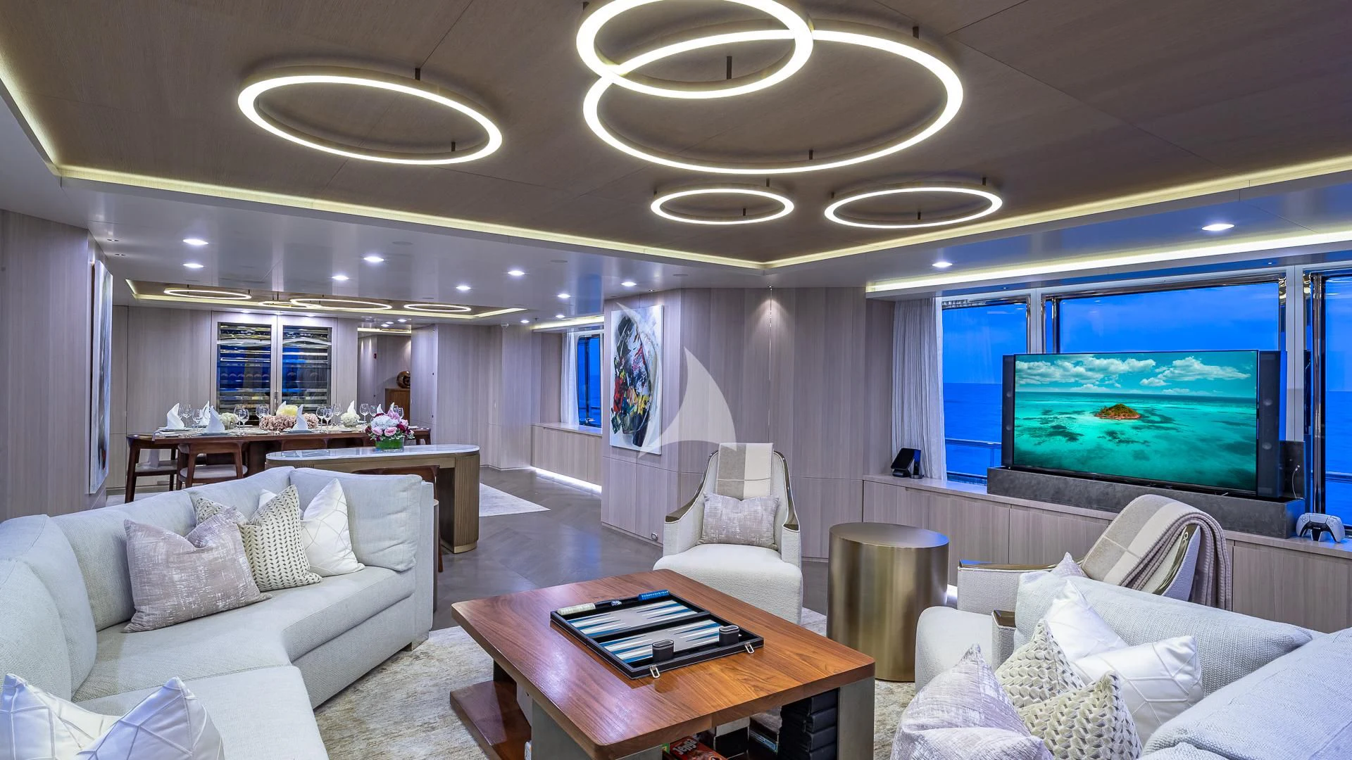 a living room with a large screen aboard REVERIE Yacht for Sale