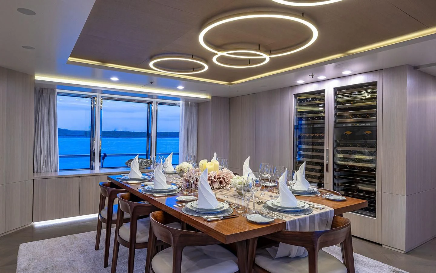 a dining room with a table and chairs aboard REVERIE Yacht for Sale