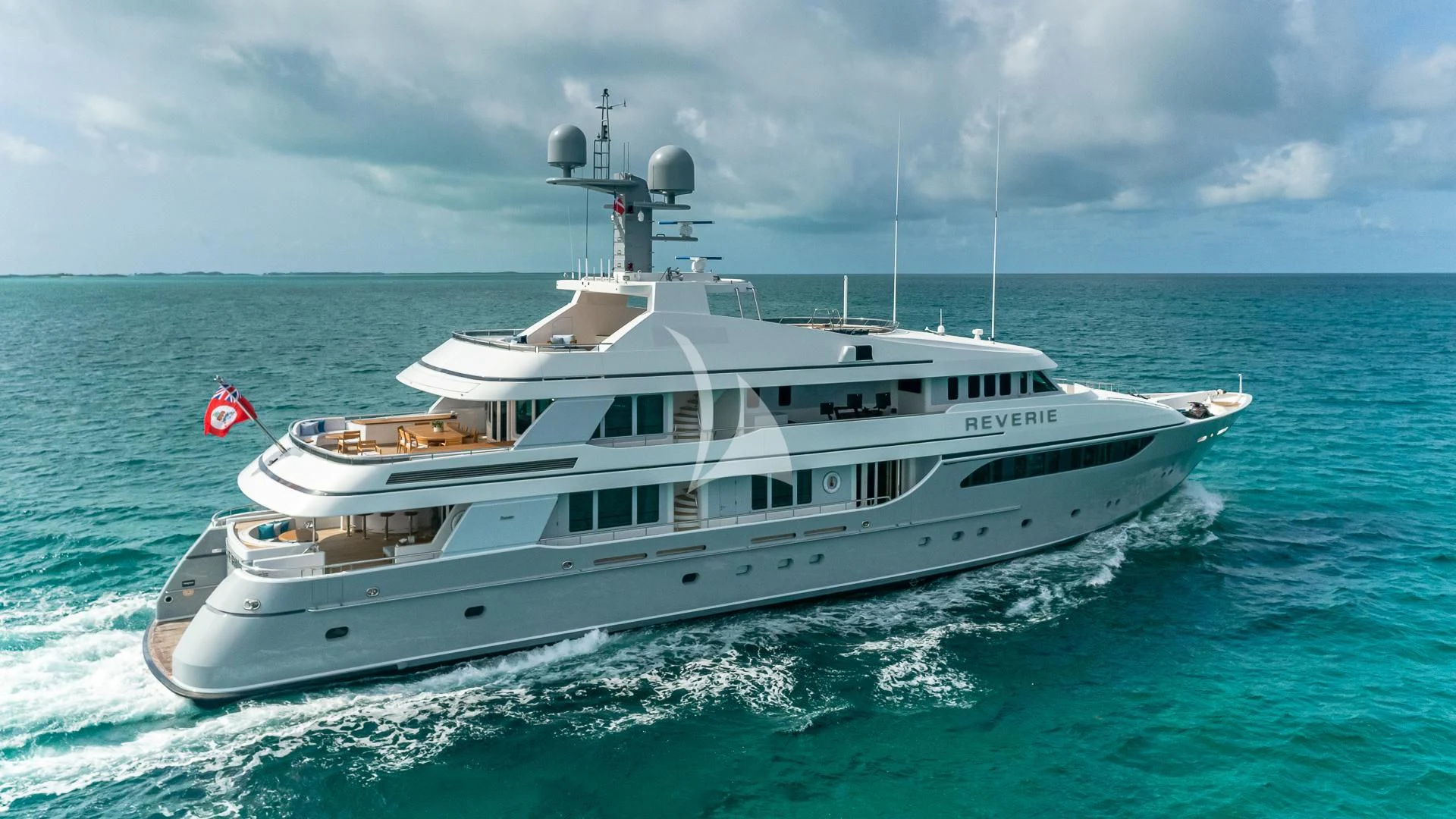 a large white yacht in the water aboard REVERIE Yacht for Sale