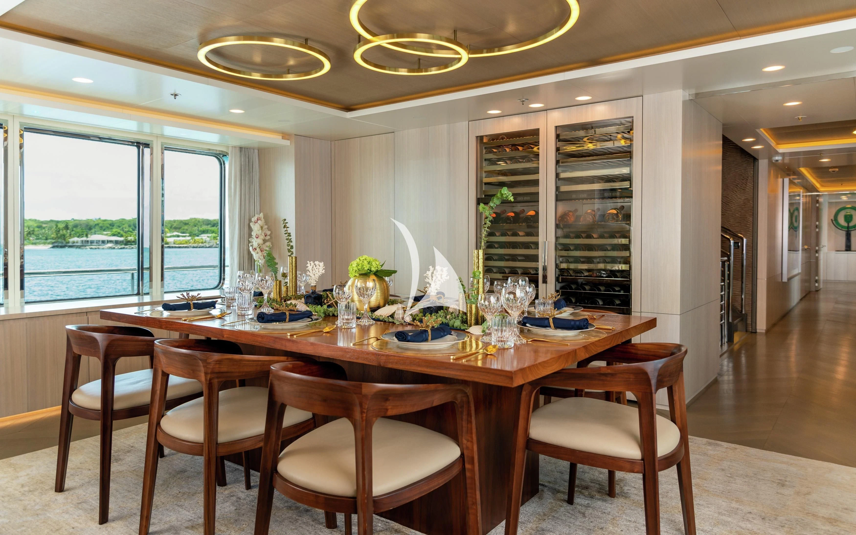 a dining table in a room aboard REVERIE Yacht for Sale