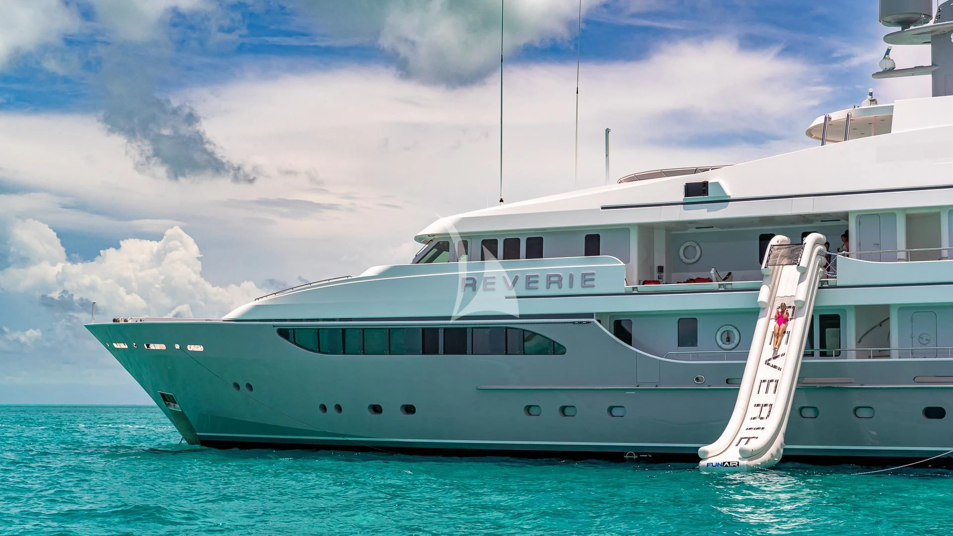 a large white boat in the water aboard REVERIE Yacht for Sale