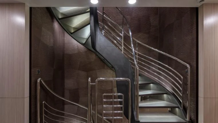 a staircase with metal railings aboard REVERIE Yacht for Sale