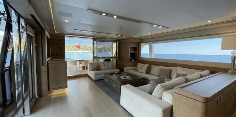 a living room with a large window aboard CENTURION Yacht for Sale