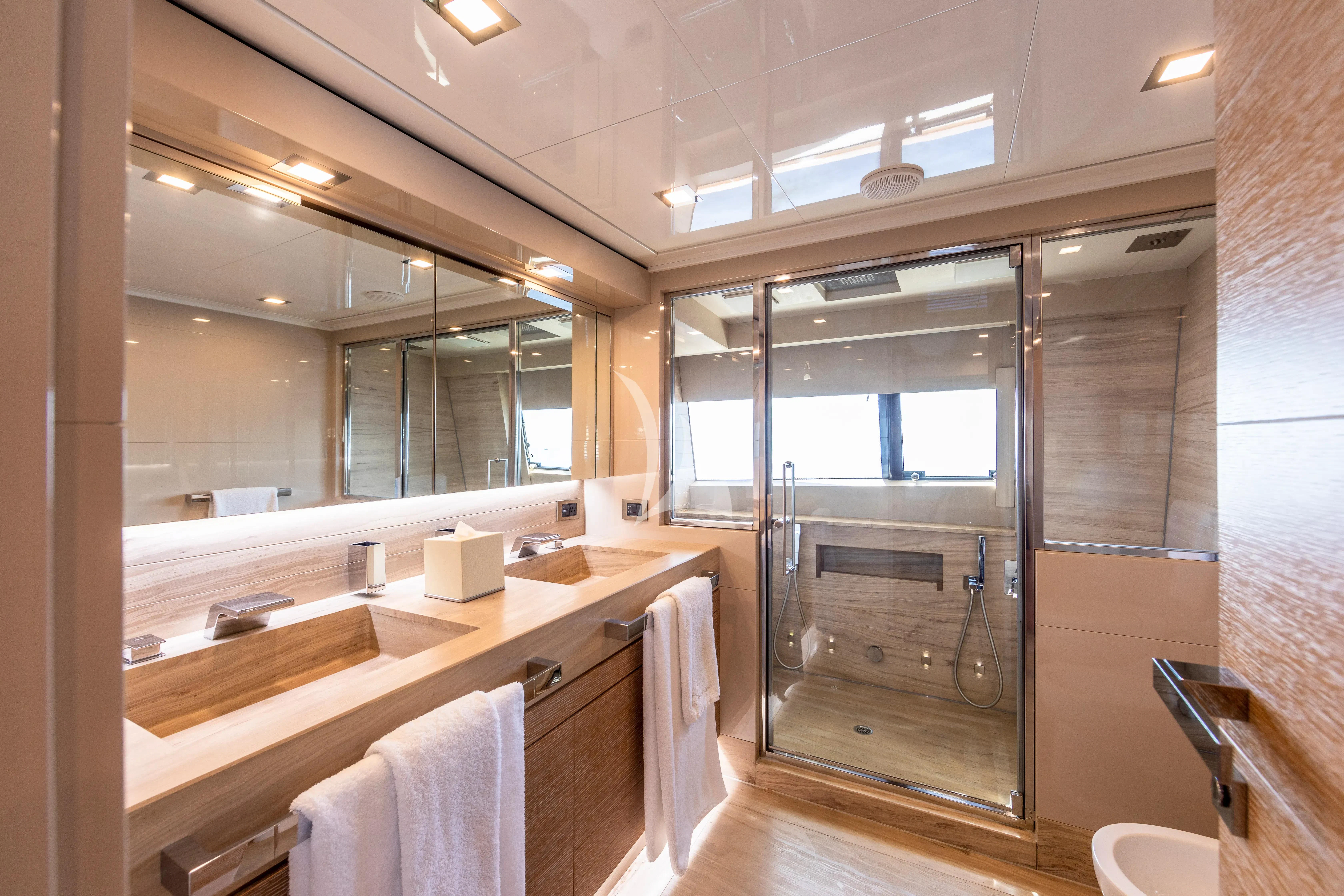 a bathroom with a large mirror aboard CENTURION Yacht for Sale