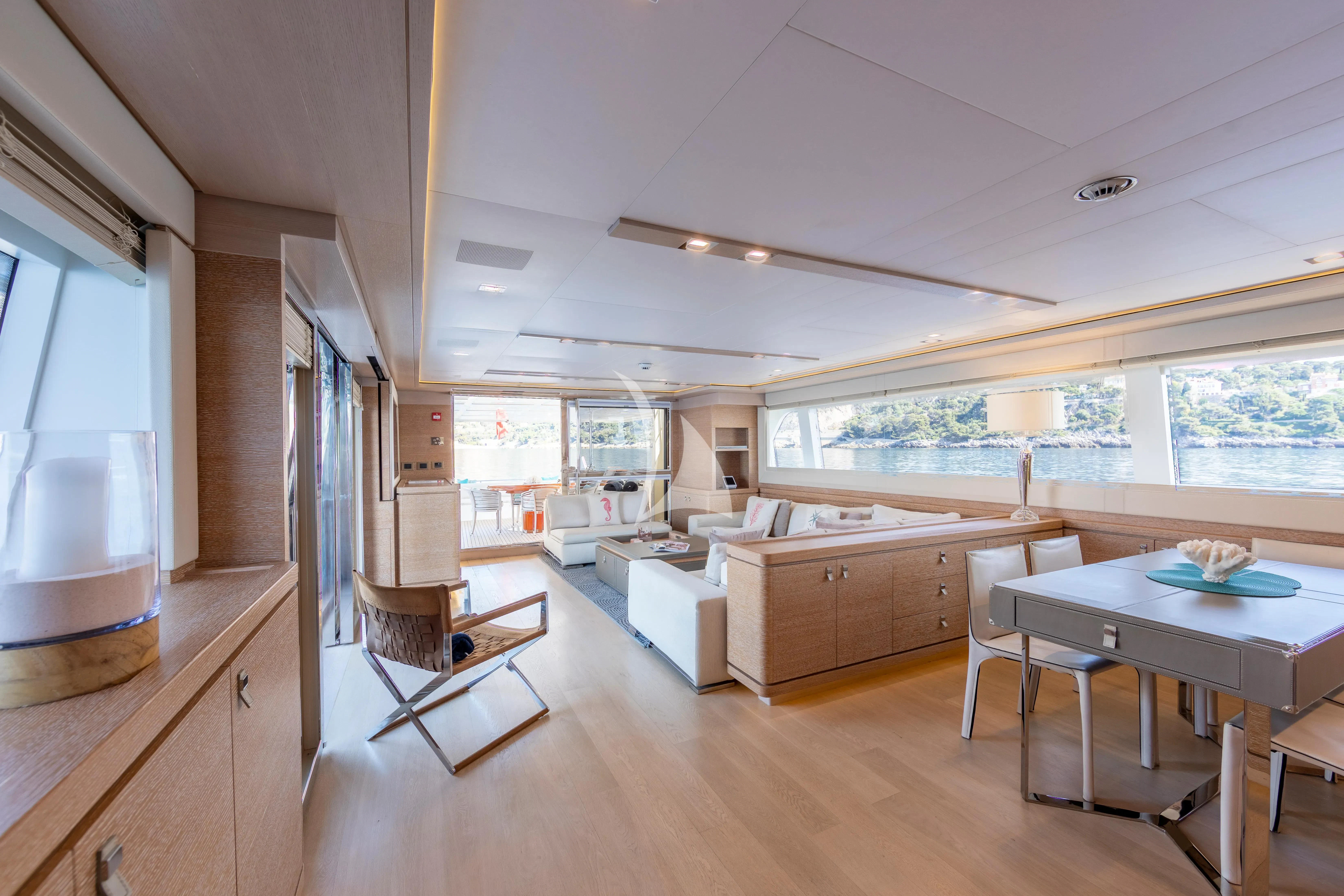 a large kitchen with a table and chairs aboard CENTURION Yacht for Sale