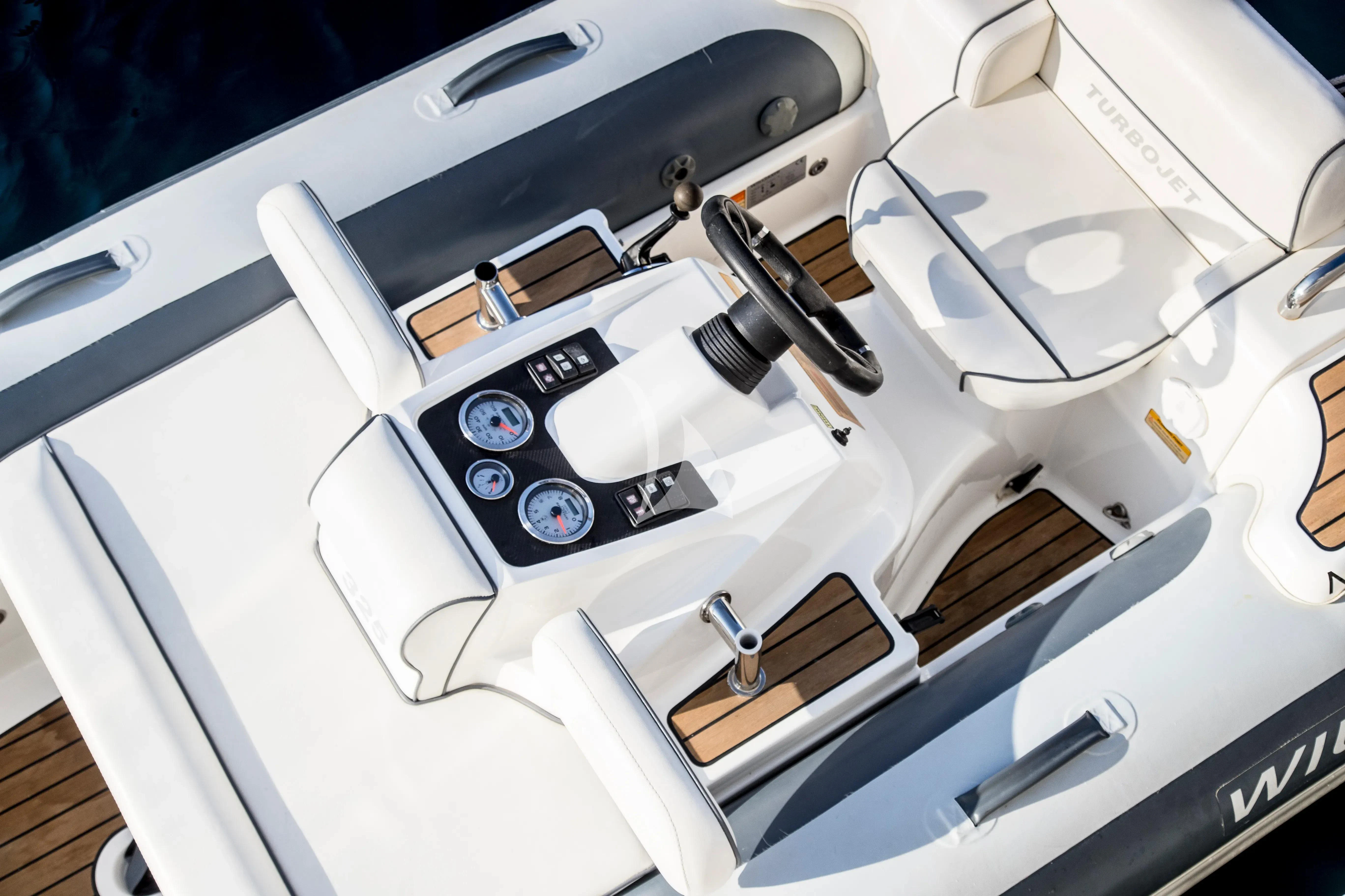 a white machine with a black top aboard CENTURION Yacht for Sale