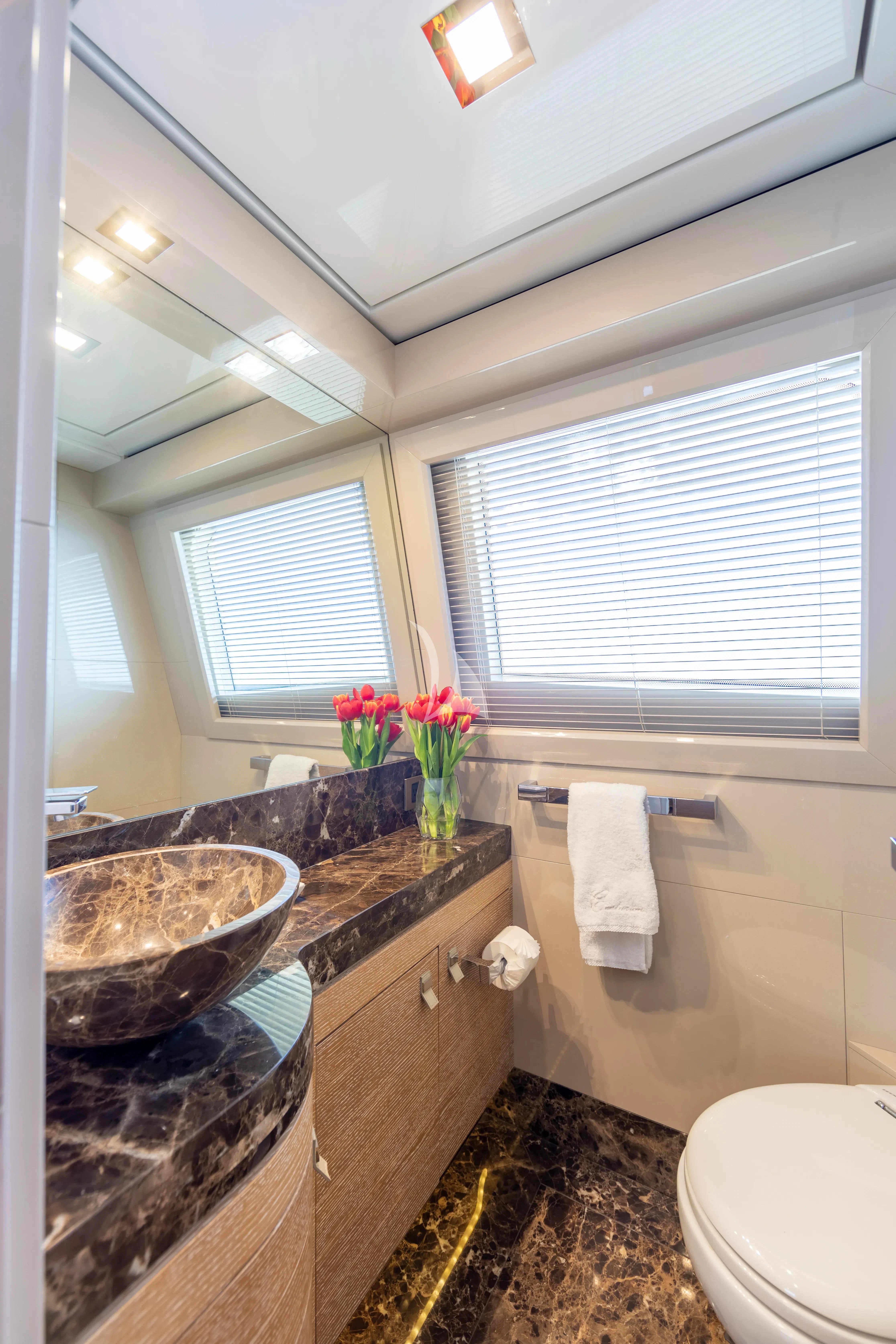 a bathroom with a marble counter top aboard CENTURION Yacht for Sale