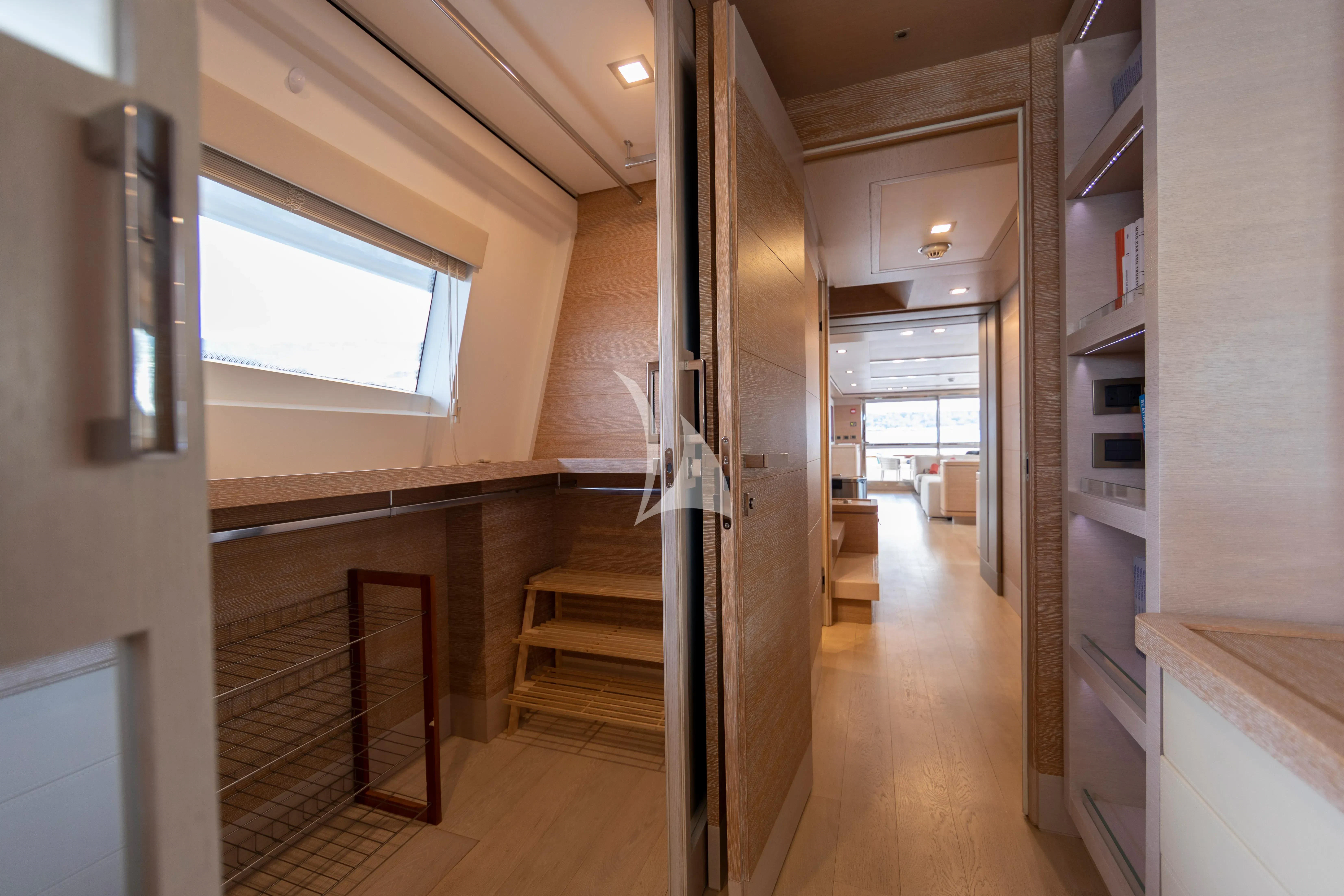 a room with a wood floor and a staircase aboard CENTURION Yacht for Sale