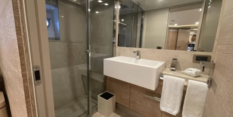 a bathroom with a sink and a mirror aboard CENTURION Yacht for Sale