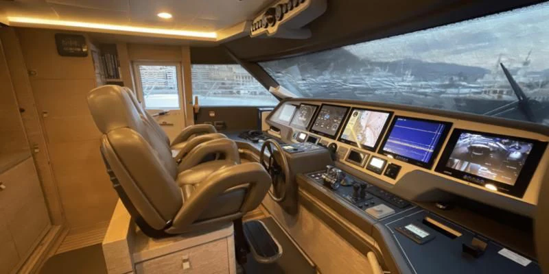 a room with computers and chairs aboard CENTURION Yacht for Sale