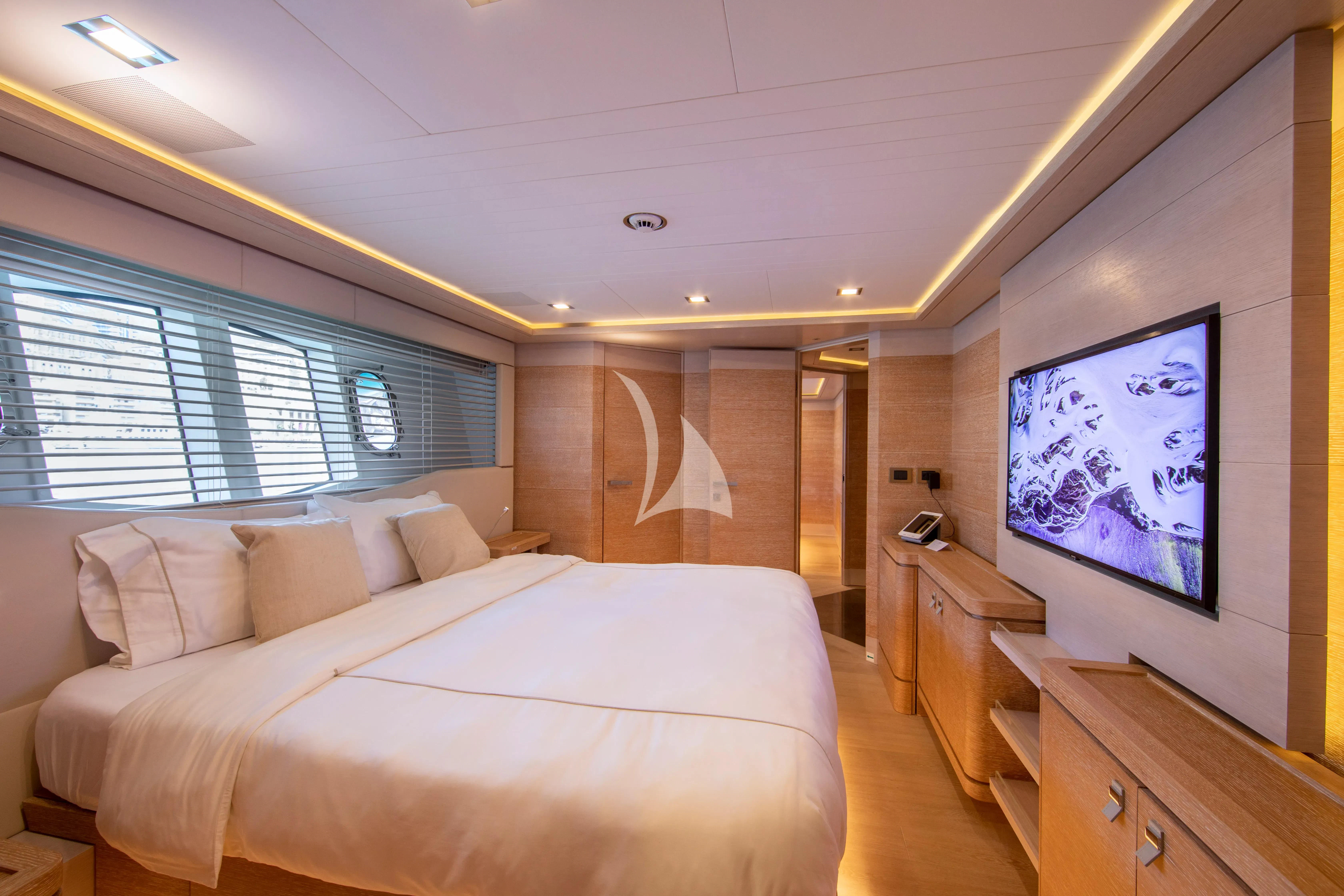 a bedroom with a large bed aboard CENTURION Yacht for Sale