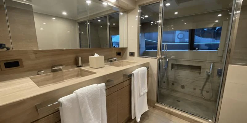 a bathroom with a large mirror aboard CENTURION Yacht for Sale