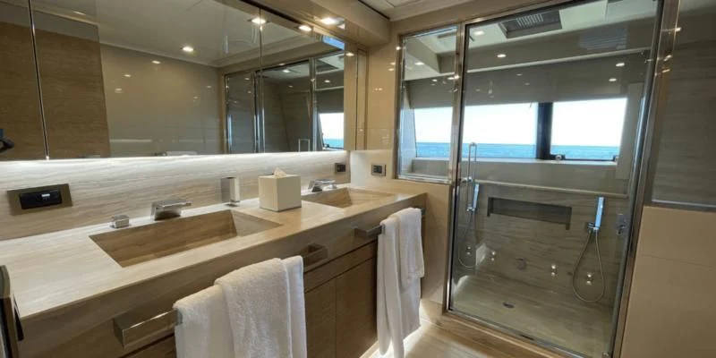 a bathroom with a large mirror aboard CENTURION Yacht for Sale
