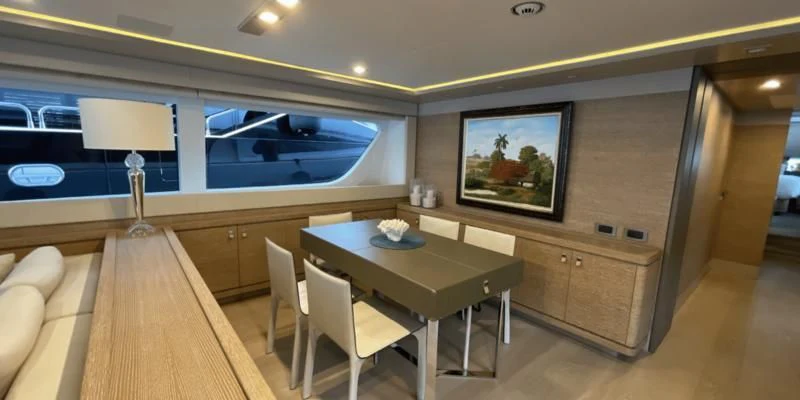 a room with a table and chairs aboard CENTURION Yacht for Sale