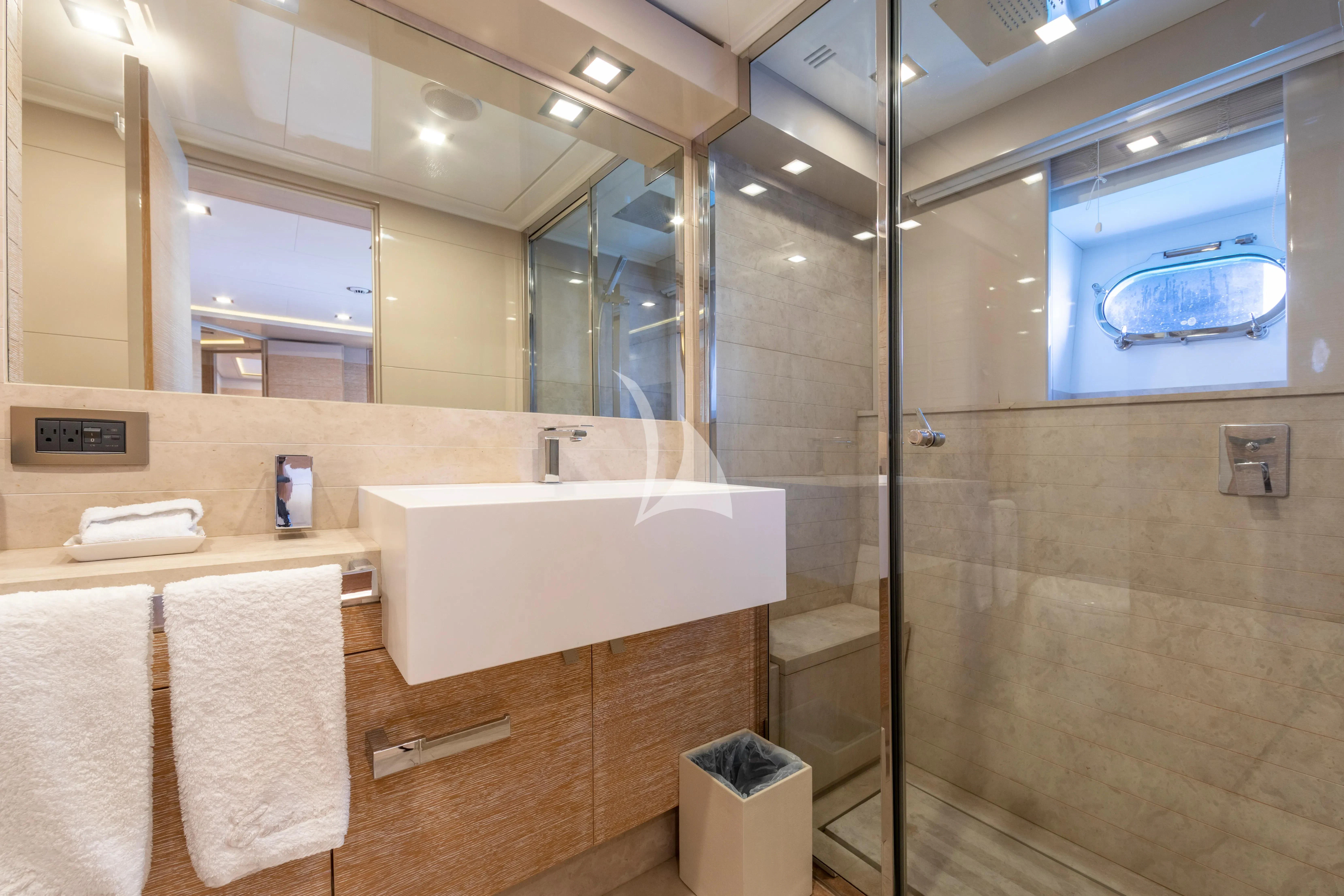 a bathroom with a glass shower aboard CENTURION Yacht for Sale