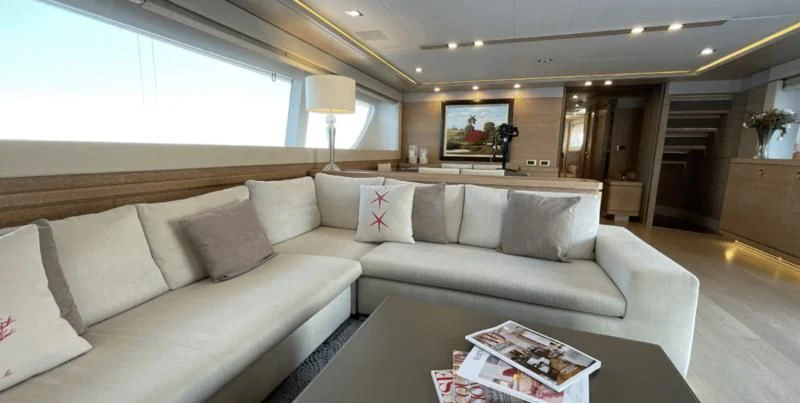 a living room with a couch and a tv aboard CENTURION Yacht for Sale