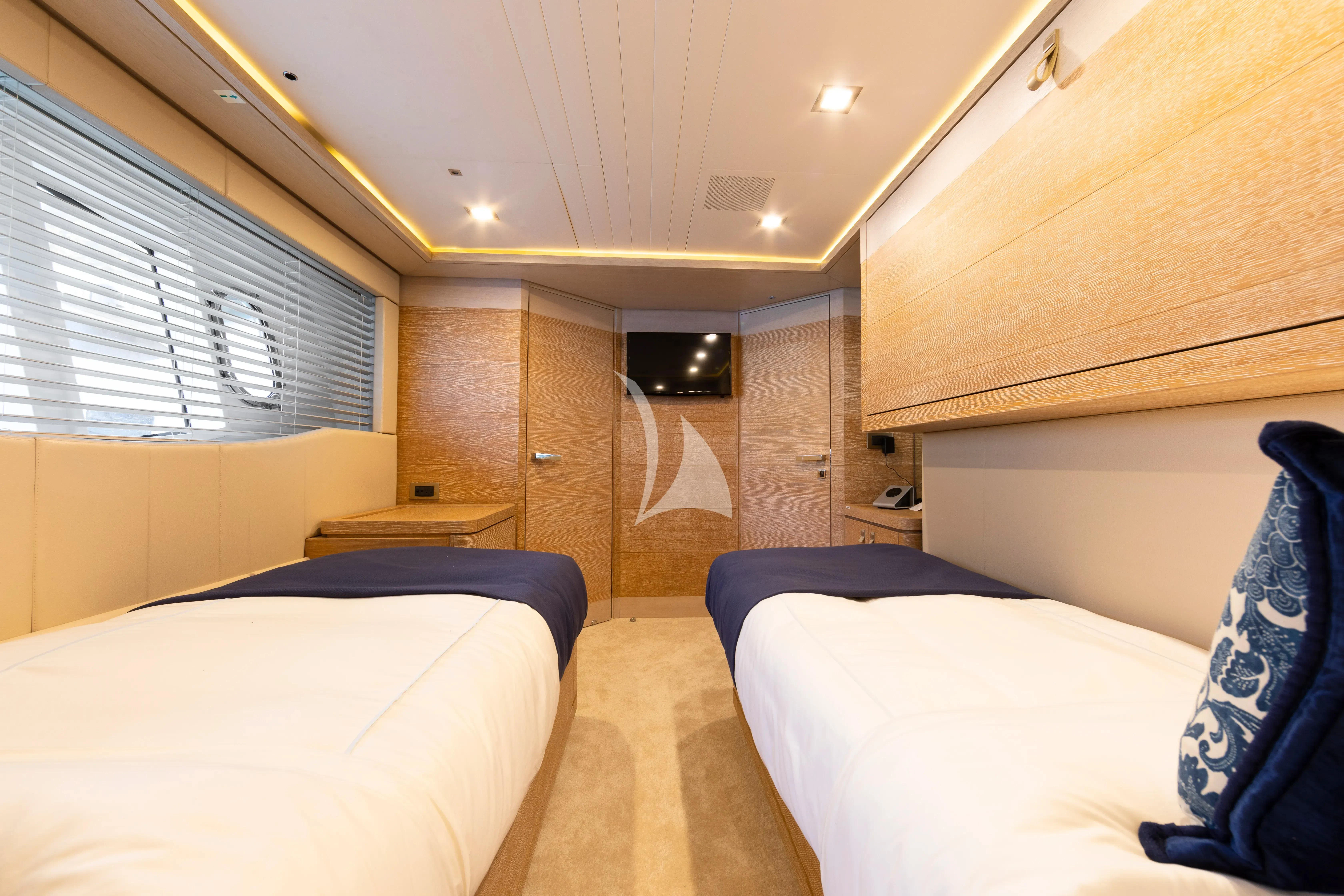 a room with beds and a wood door aboard CENTURION Yacht for Sale