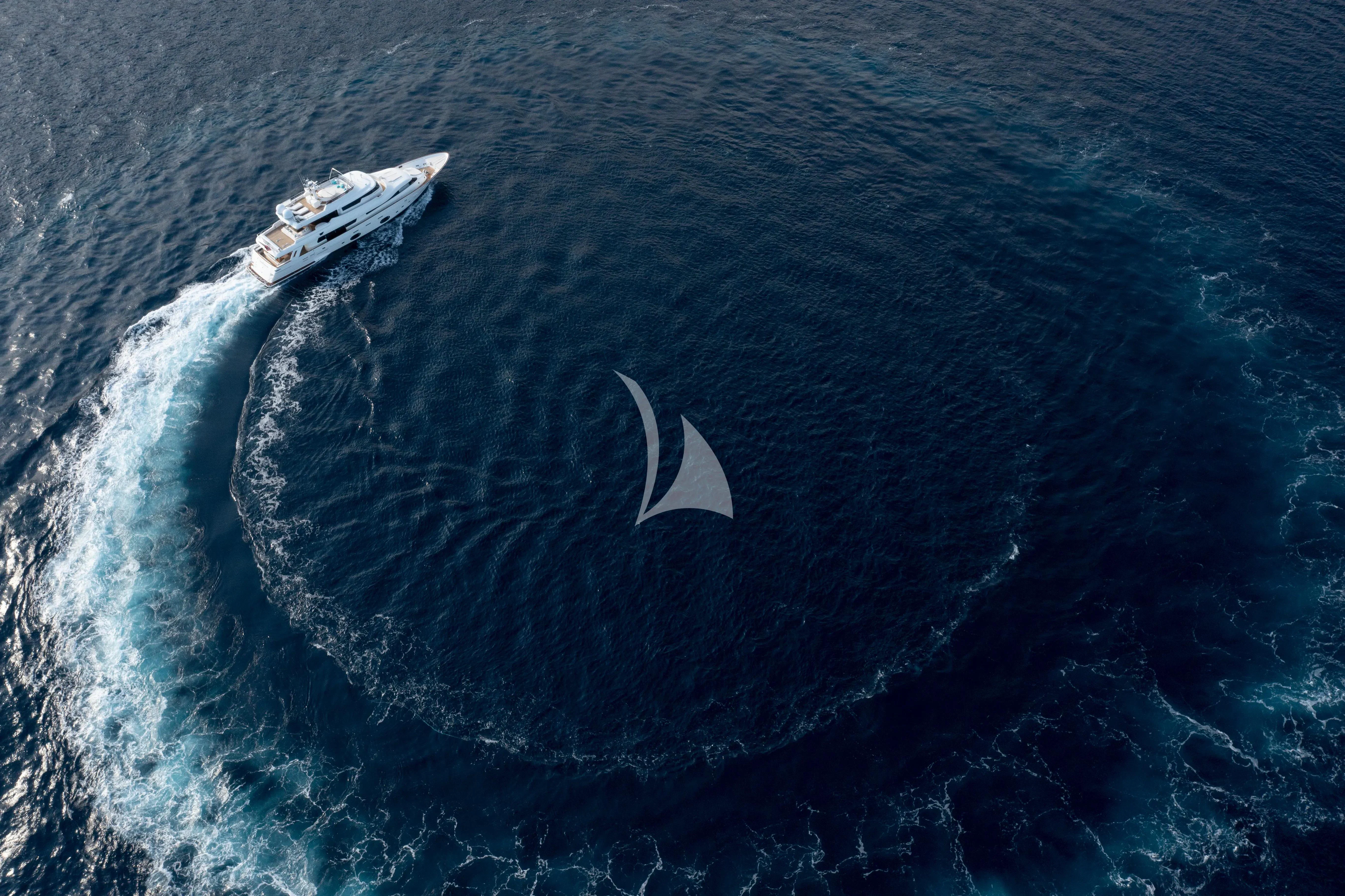 a whale swimming in the ocean aboard CENTURION Yacht for Sale