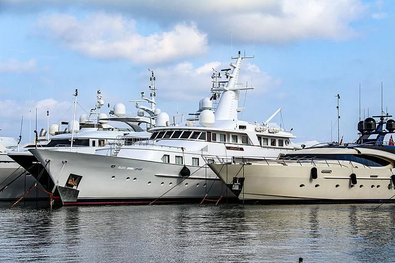 a white yacht in the water aboard KALINGA Yacht for Sale