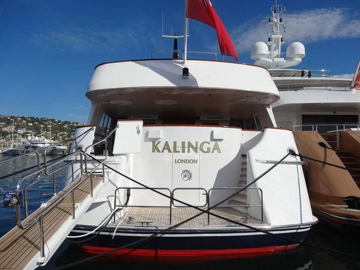a large white boat in a harbor aboard KALINGA Yacht for Sale